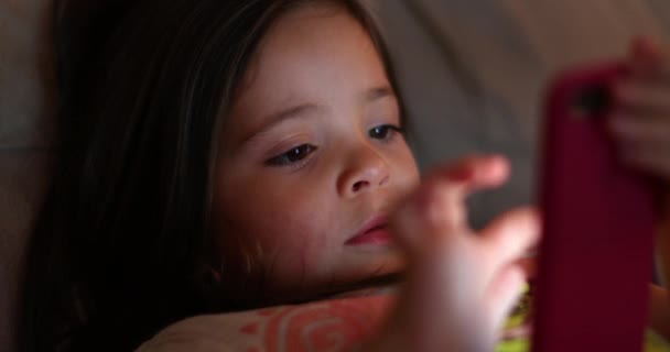 Little Girl Child Using Smartphone Device Light Glowing Girl Face — Vídeo de Stock