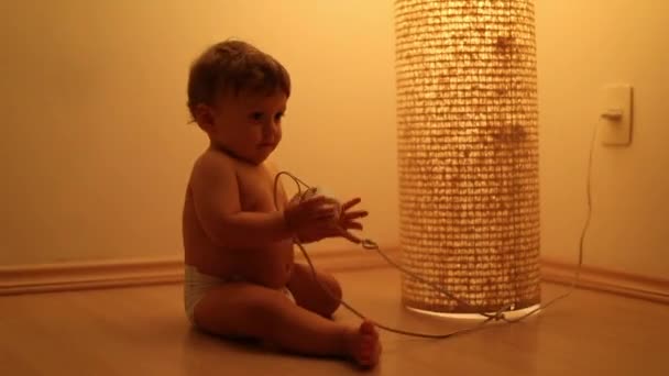 Baby Plays Lamp Object — Stock Video