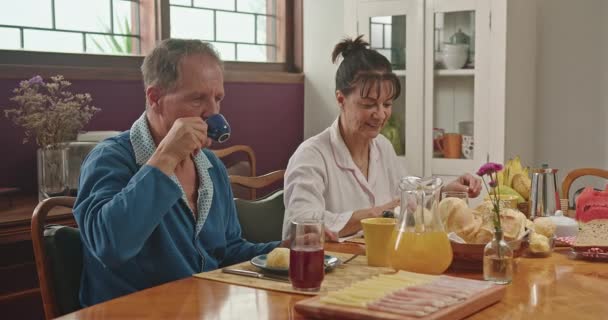 Woman Chats Her Husband While Enjoying Nice Breakfast Man Drinks — Vídeos de Stock