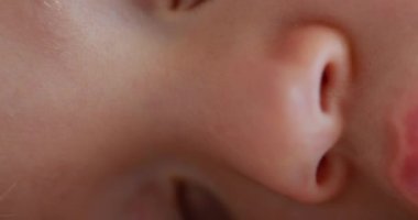 Infant macro face close-up mouth nose and eyes detail
