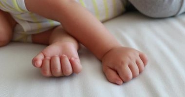 Baby hands close-up napping. One year old toddler infant asleep hand detail
