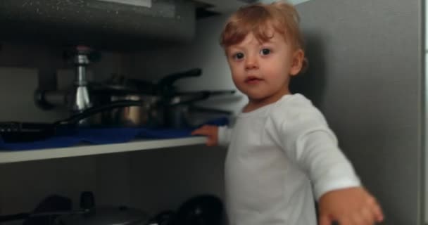 Baby Standing Kitchen Floor Opening Closet Door Cupboard Cabinet — Stockvideo