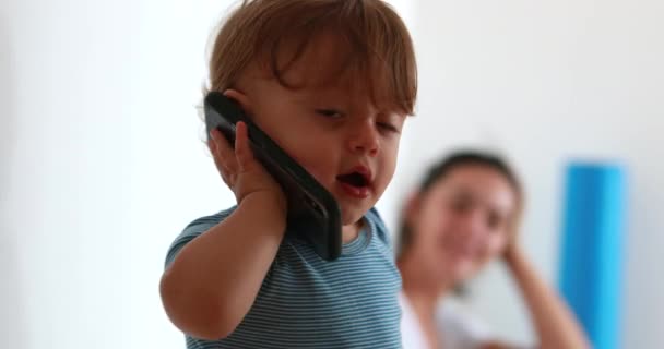 Funny Baby Talking Phone Infant Child Holding Cellphone Ear — Video Stock