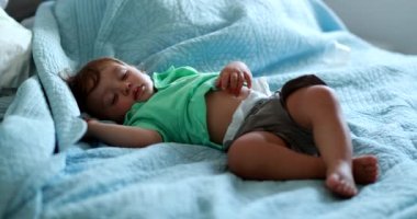 Baby sleeping in bed nap. Infant boy asleep. Toddler napping