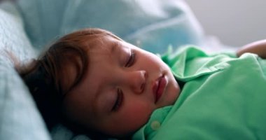 Cute baby toddler asleep napping. Infant child sleeping nap