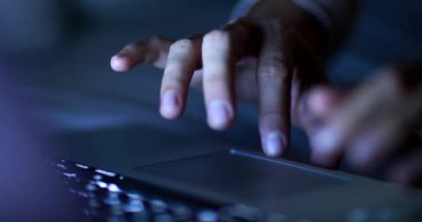 Hand close-up using laptop computer, closeup fingers pressing keyboard pad