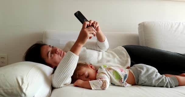 Mother Using Smartphone Next Sleeping Baby Parent Typing Cellphone Infant — Vídeos de Stock