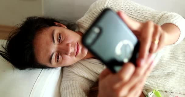 Mother Using Cellphone Next Sleeping Baby Parent Lying Couch Typing — Stok video