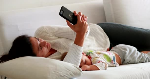 Parent Lying Couch Using Cellphone Baby Sleeping — Wideo stockowe