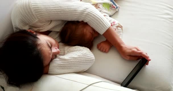 Parent Lying Floor Watching Media Smartphone Next Sleeping Baby — Video Stock