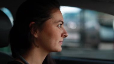 Woman waiting in traffic red light, female driver face waits
