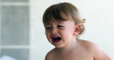 Baby boy crying, hurt infant child cries