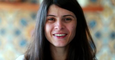 Portrait attractive woman looking at camera, 30 year old girl face smiling