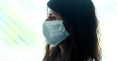 Woman removing covid-19 pandemic mask prevention, person removes surgical face mask