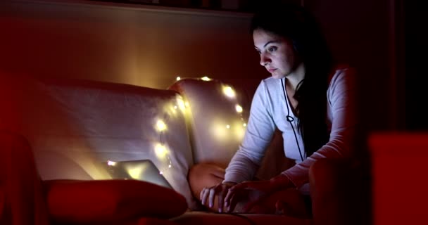 Woman Using Laptop Night Putting Headphones Browsing Internet — Wideo stockowe