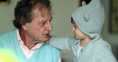 Candid grandparent with grandchild son baby toddler