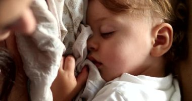 Toddler boy dreaming sleeping deeply. Child asleep dream