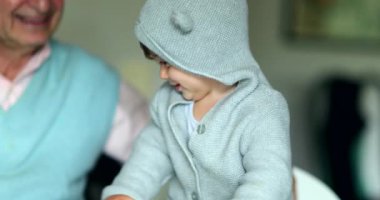 Cute baby wearing hoodie. Portrait adorable infant child toddler boy