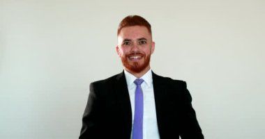 Business executive celebrating success, happy redhair irish person feeling joy smiling