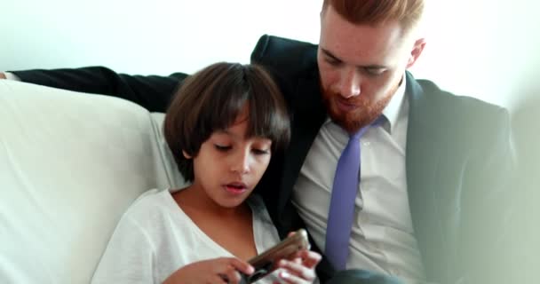 Candid Father Son Together Home Couch Sharing Cellphone Screen Mixed — Stock videók