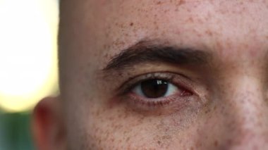 Happy man opening eyes smiling to camera, macro closeup face, ginger handsome male