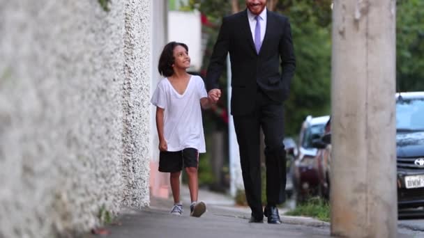 Happy Father Son Walking Together Holding Hands Sidewalk Diverse Mixed — Vídeo de stock