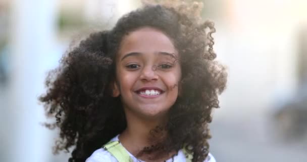 Happy Female Child Smiling Mixed Race Kid Curly Hair Wind — Stockvideo