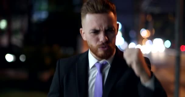 Happy Business Man Walking Night City Celebrating Success Raising Fist — Stockvideo