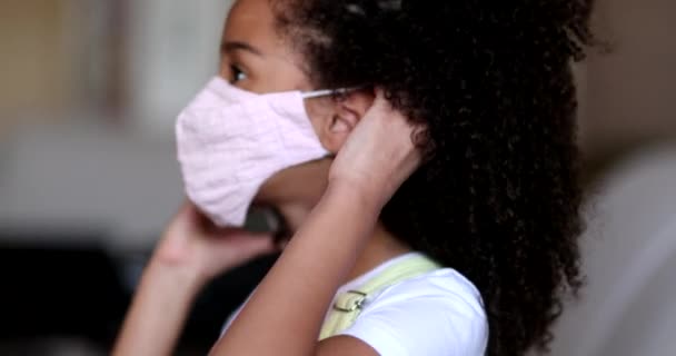 Little Girl Putting Covid Face Mask Mixed Race Child Puts — Wideo stockowe