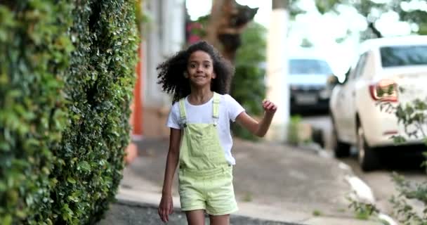 Happy Little Girl Hopping City Sidewalk Mixed Race Kid Walking — Stockvideo