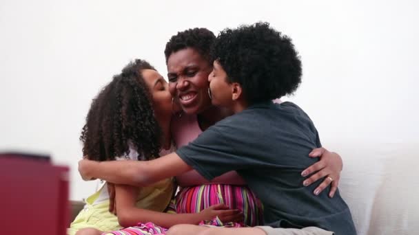 Children Kissing Mother Cheek Mix Race Little Brother Sister Hug – stockvideo