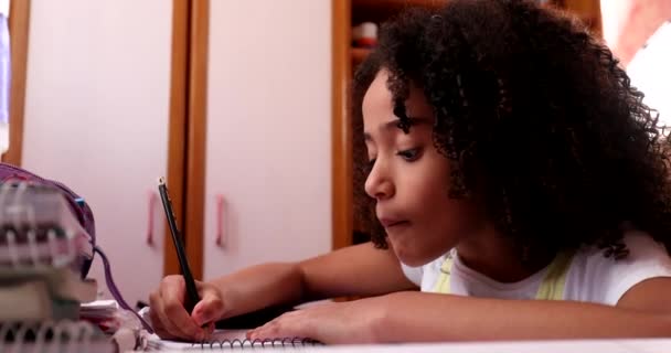 Mixed Race Girl Writing Notes Doing Homework Home Little Girl — Vídeo de stock