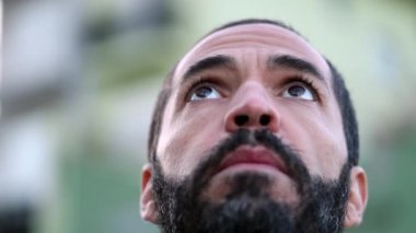 Man face looking up to sky