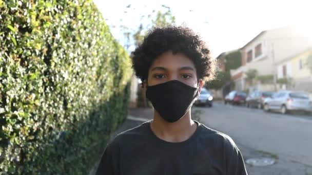 Teen Boy Wearing Face Mask Walking City Sidewalk — Video