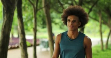 African black man walking in nature smiling and laughing