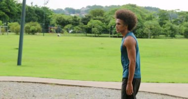 Handsome african man walking at park