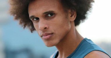 Serious handsome african mixed race man facing camera portrait