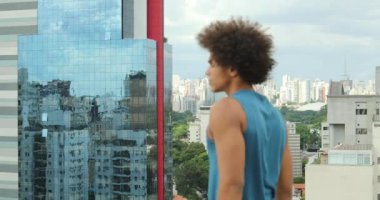 Confident black african man turning towards camera with serious expression