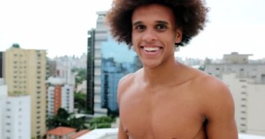 Mixed race young man smiling