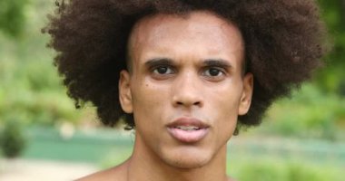 Serious dramatic african man looking to camera