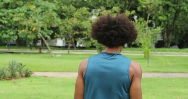 Young African Afro Hair Man Walking Park — Stockvideo