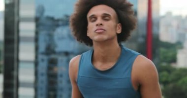 Young black man screaming in despair, changing emotions, from everything is ok and calm to complete frustration