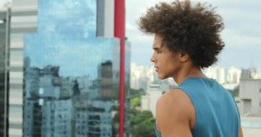 Confident black african man looking at city view landscape