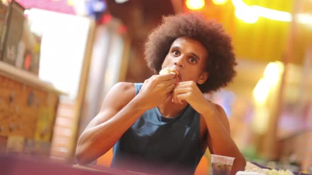 Handsome Young Black Guy Eating Fastfood Hot Dog — 비디오