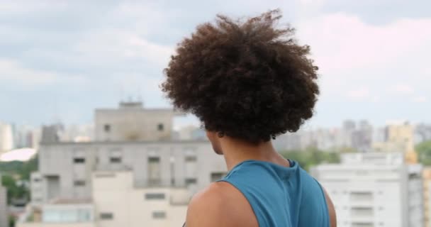 Young Black Man Overlooking City View Top Building Casual Sport — Video Stock