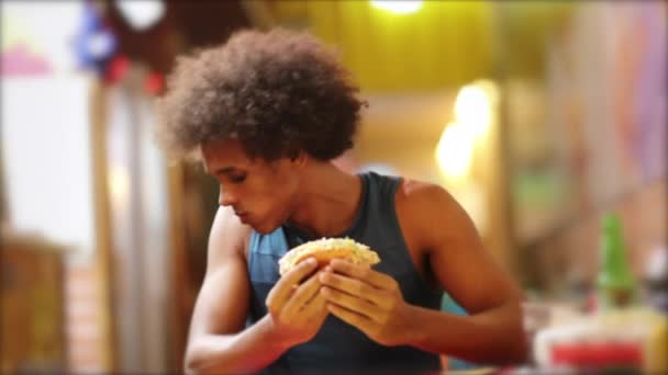 Young Black Guy Eating Fast Food Hot Dog — Wideo stockowe