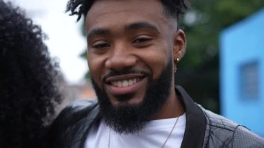 A handsome young black man portrait smiling at camera