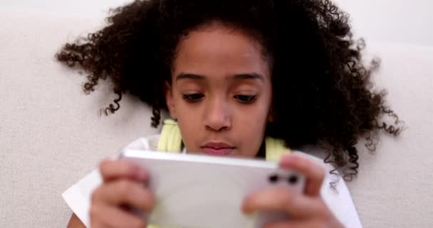 Child Playing Game Cellphone Sitting Couch — Vídeo de stock