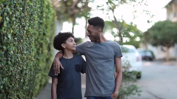 Older Brother Walking Younger Sibling Together Giving Advice Life Mixed — Videoclip de stoc