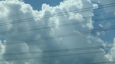 Car Passenger view of wires. Daydreaming feel of passing time